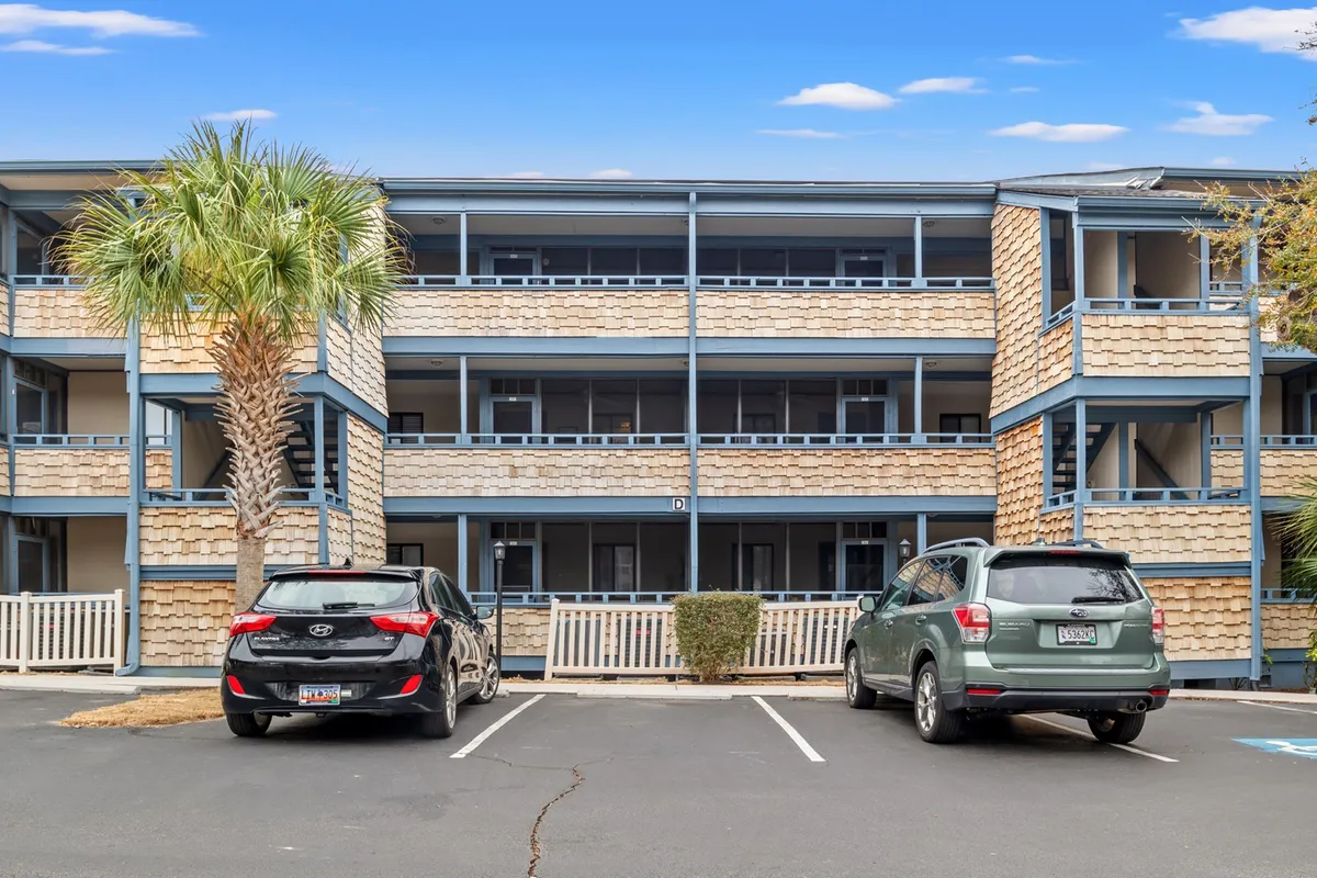 An exterior view featuring a palm tree, the building's facade, and parked vehicles, with visible balconies and landscaped pathways. The image suggests opportunities for outdoor relaxation and socializing among neighbors, as well as sunset views and moments of community.